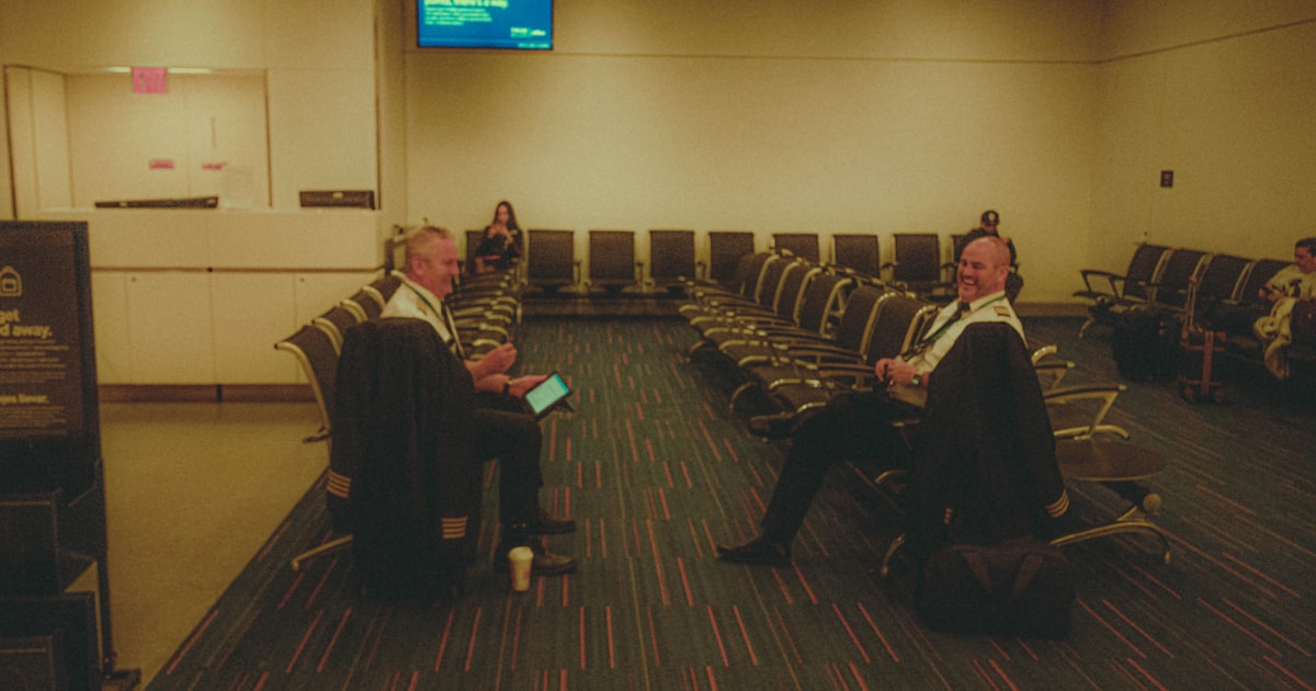 a group of people sitting in chairs in a room