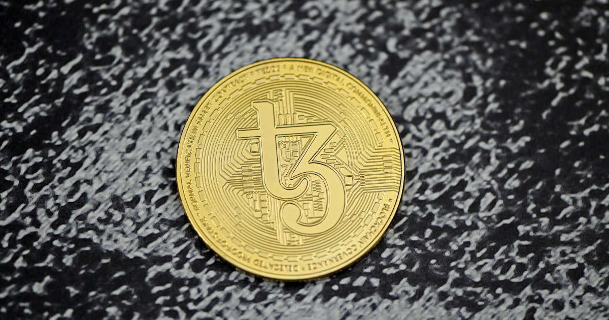a close up of a coin on a black surface