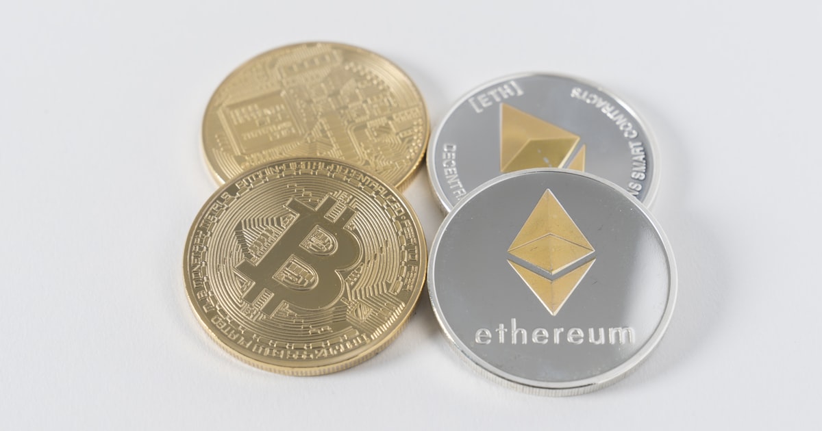 four round silver-colored and gold-colored Bitcoins