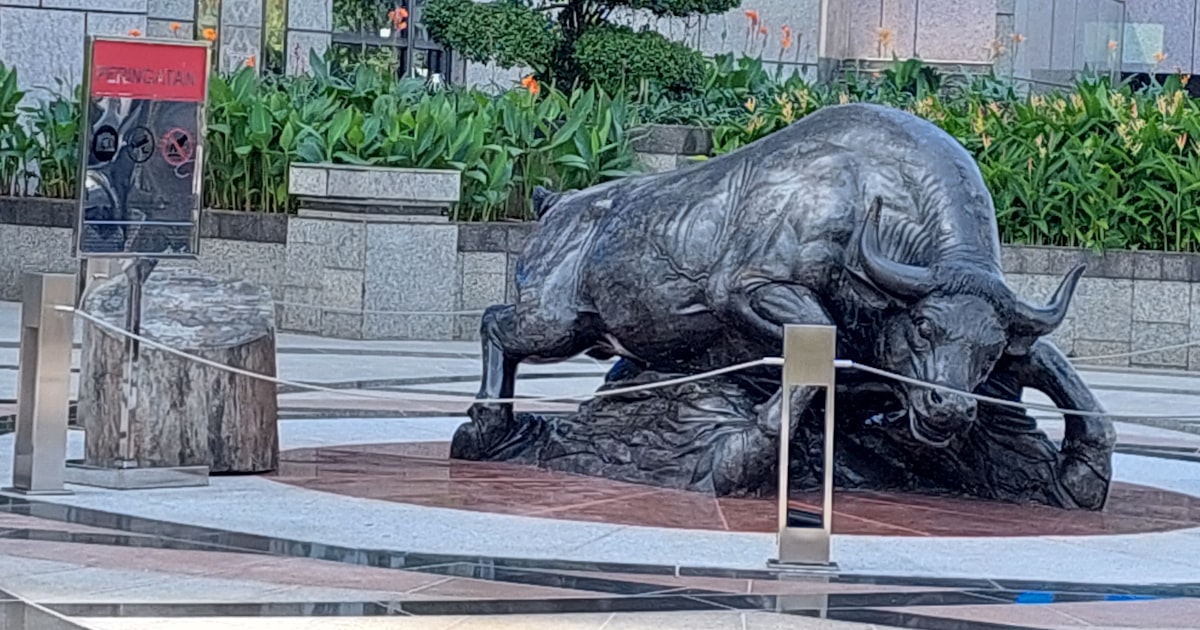 a statue of a bull in a courtyard