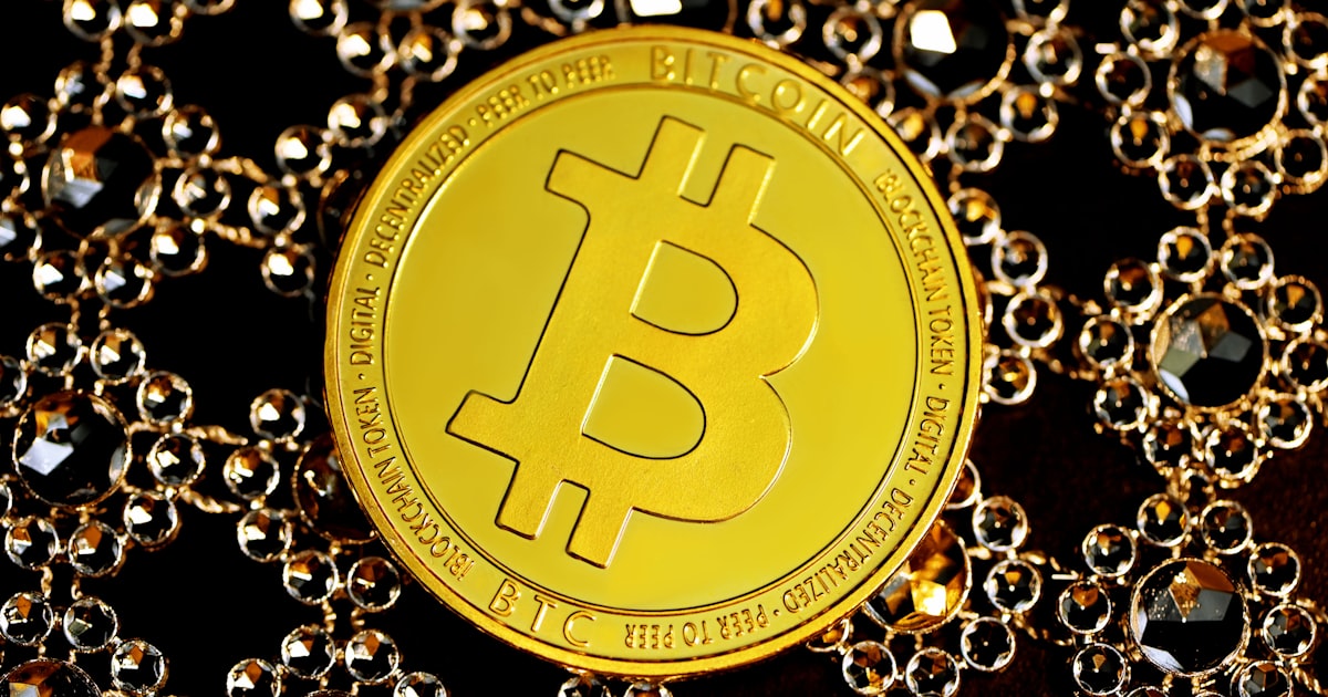 gold round coin on black beads