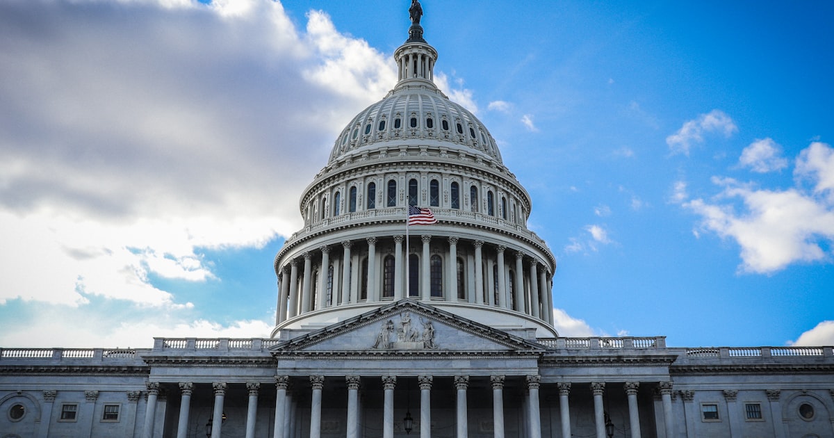 white concrete building under blue sky during daytime