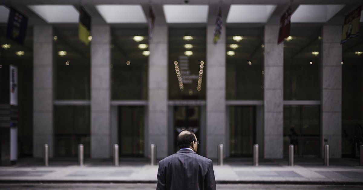 man standing in front of building