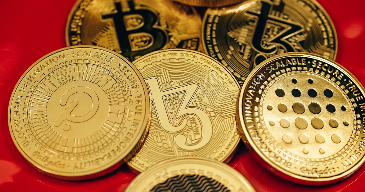 a pile of bitcoins sitting on top of a red table