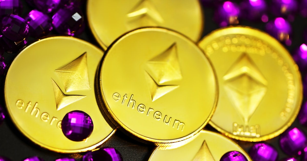 gold and purple round coin