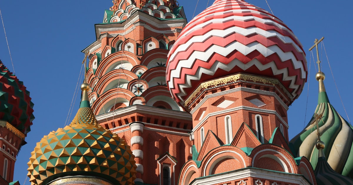 A close up of a building with many domes