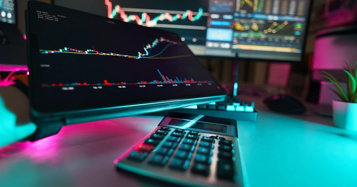 A desk with a keyboard and a monitor
