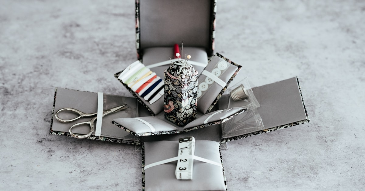 scissors and knitting kits on box