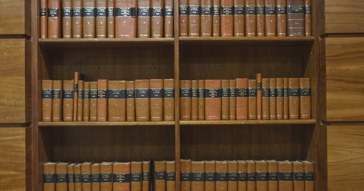 a wooden bookcase filled with lots of books
