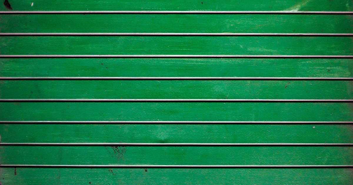 green wooden wall during daytime