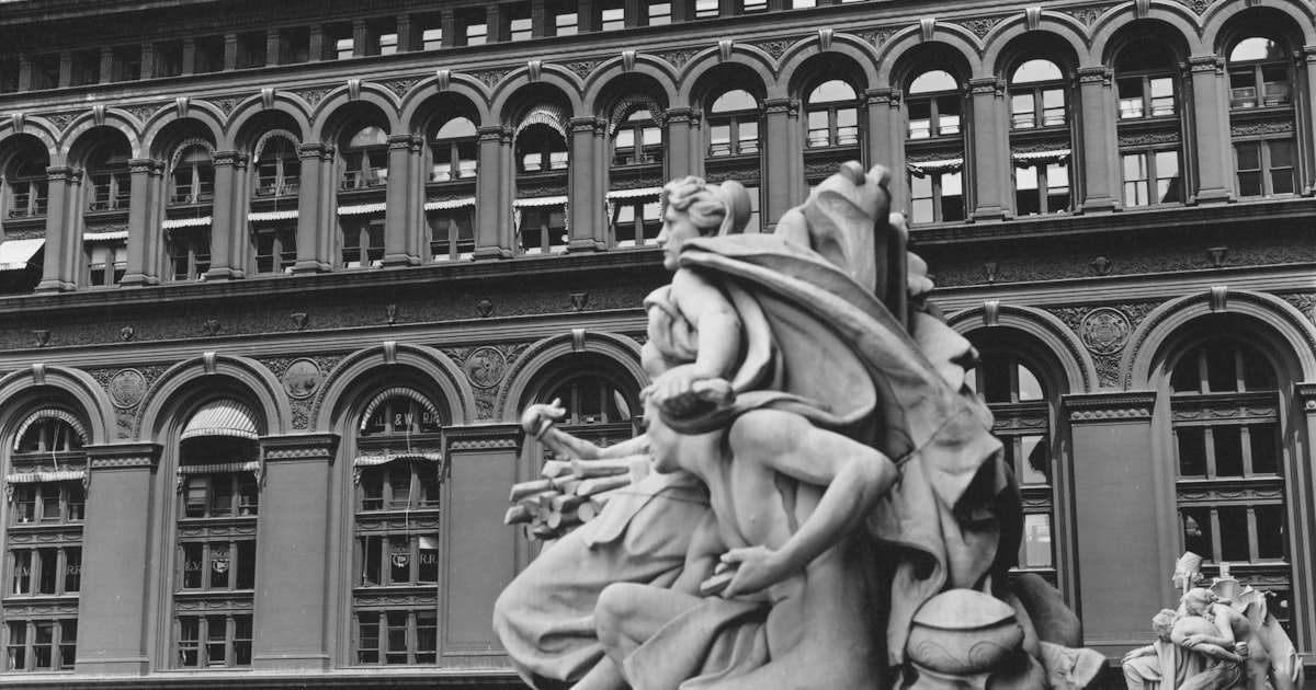 Ornate sculpture in front of a historic building