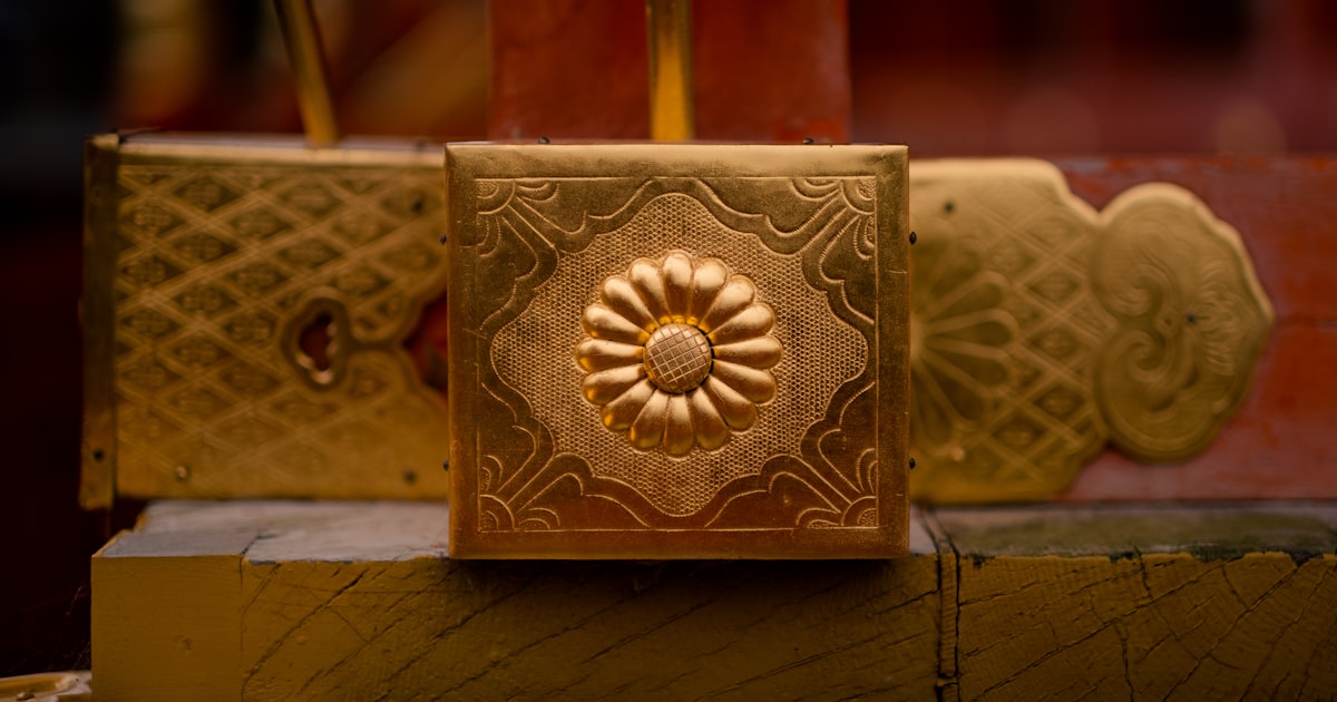 a close up of a golden object on a table