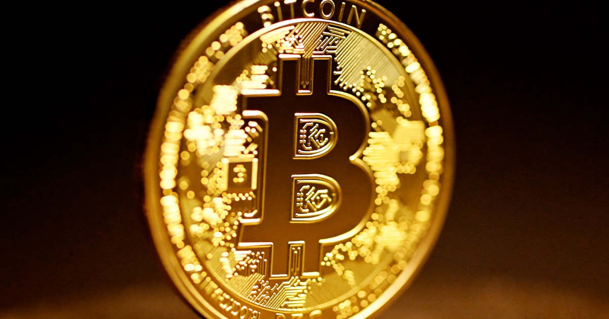 gold and black round logo