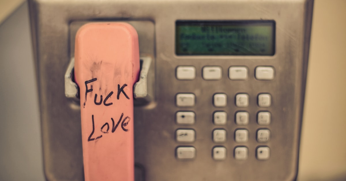 a phone with a pink sticker on the back of it