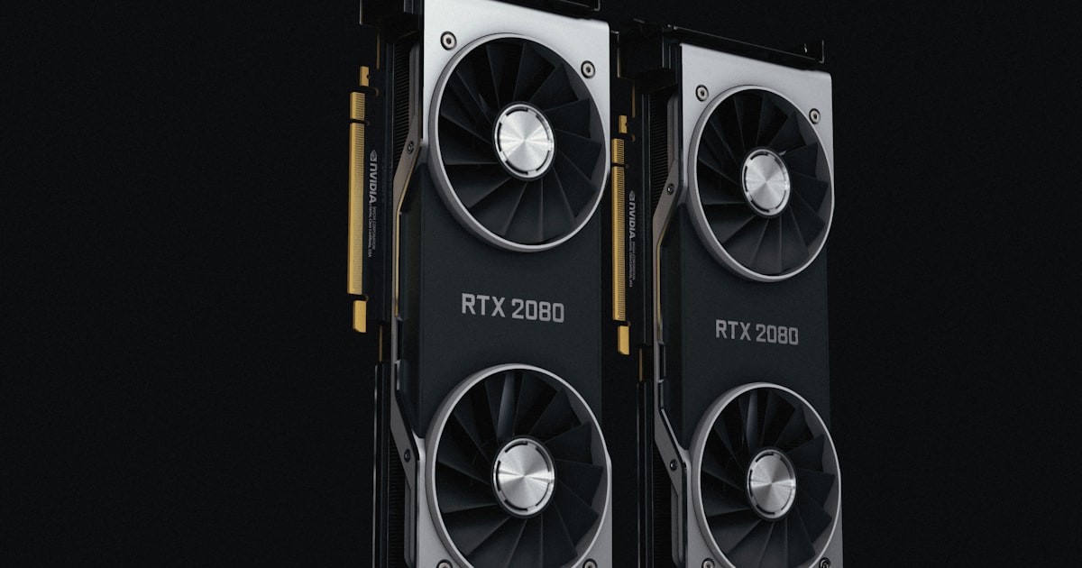 a pair of black and silver graphics cards