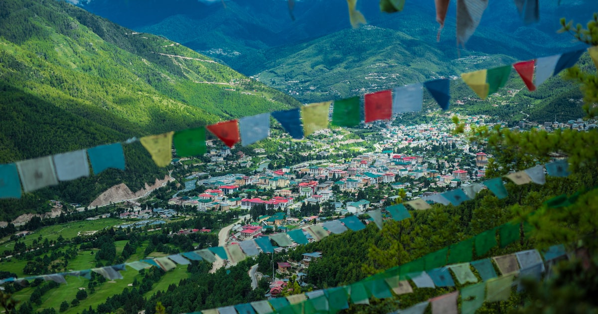 green mountain under white clouds during daytime
