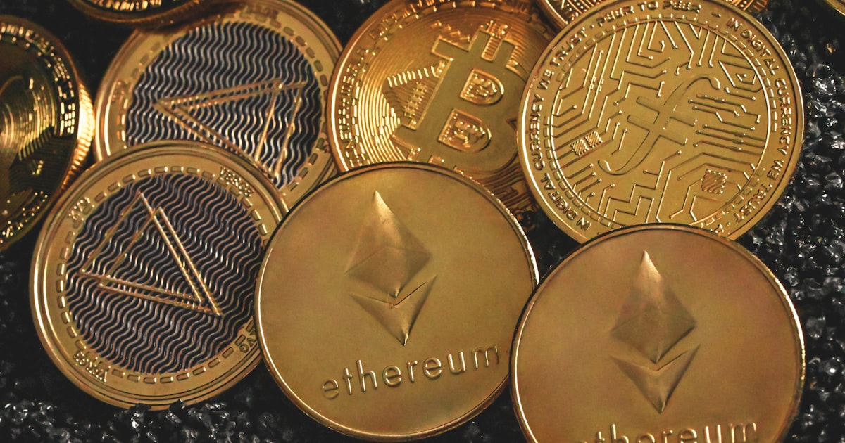 a pile of gold bitcoins sitting next to each other