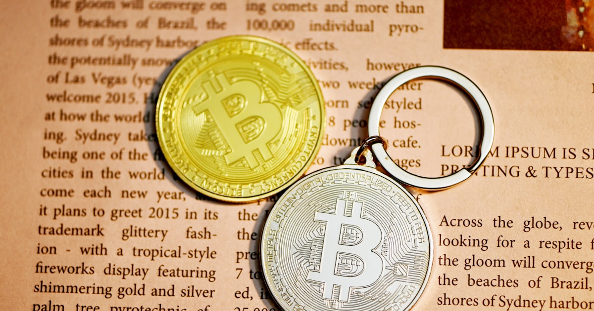 gold round coin on brown paper