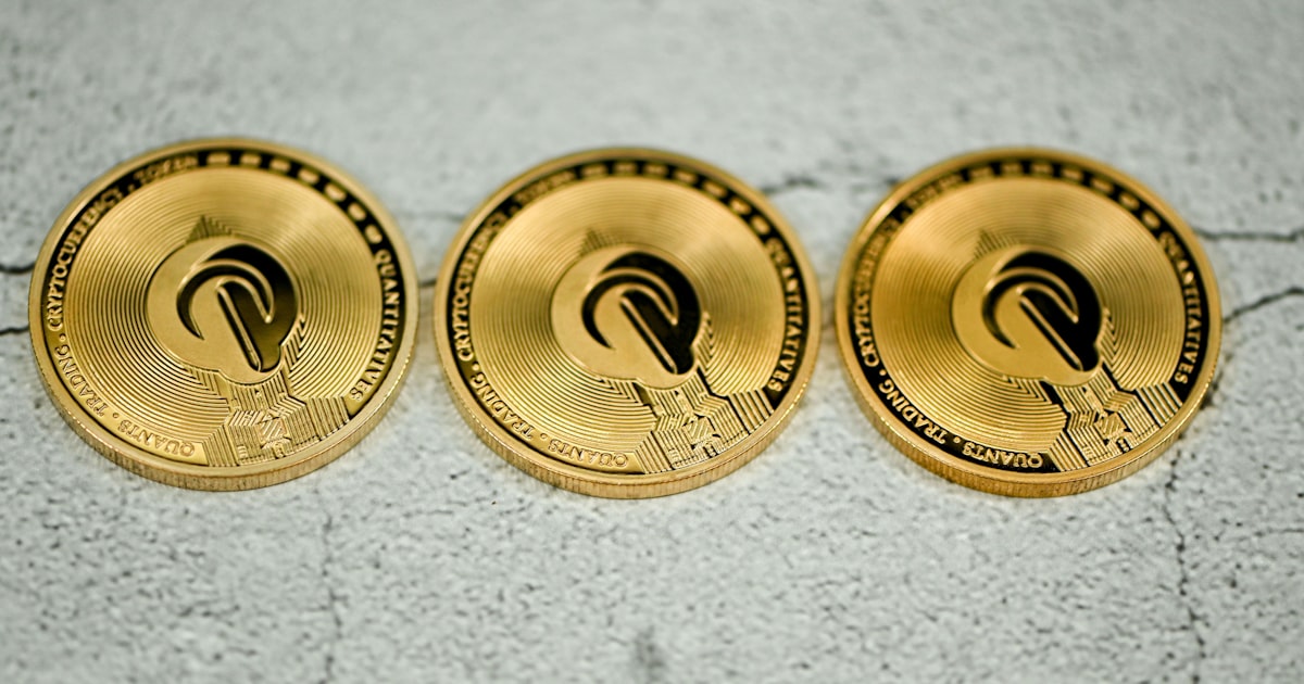 three gold coin sitting on top of a cement floor