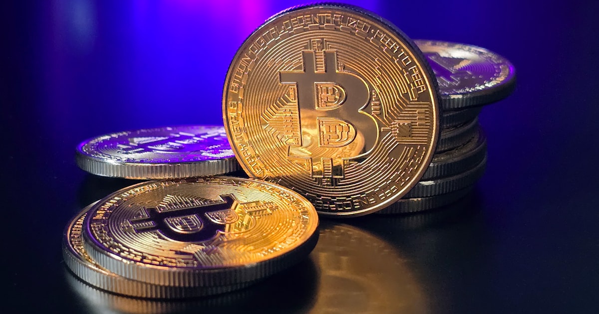 a pile of bitcoins sitting on top of a table