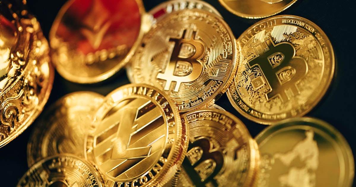 a pile of gold bitcoins sitting on top of each other