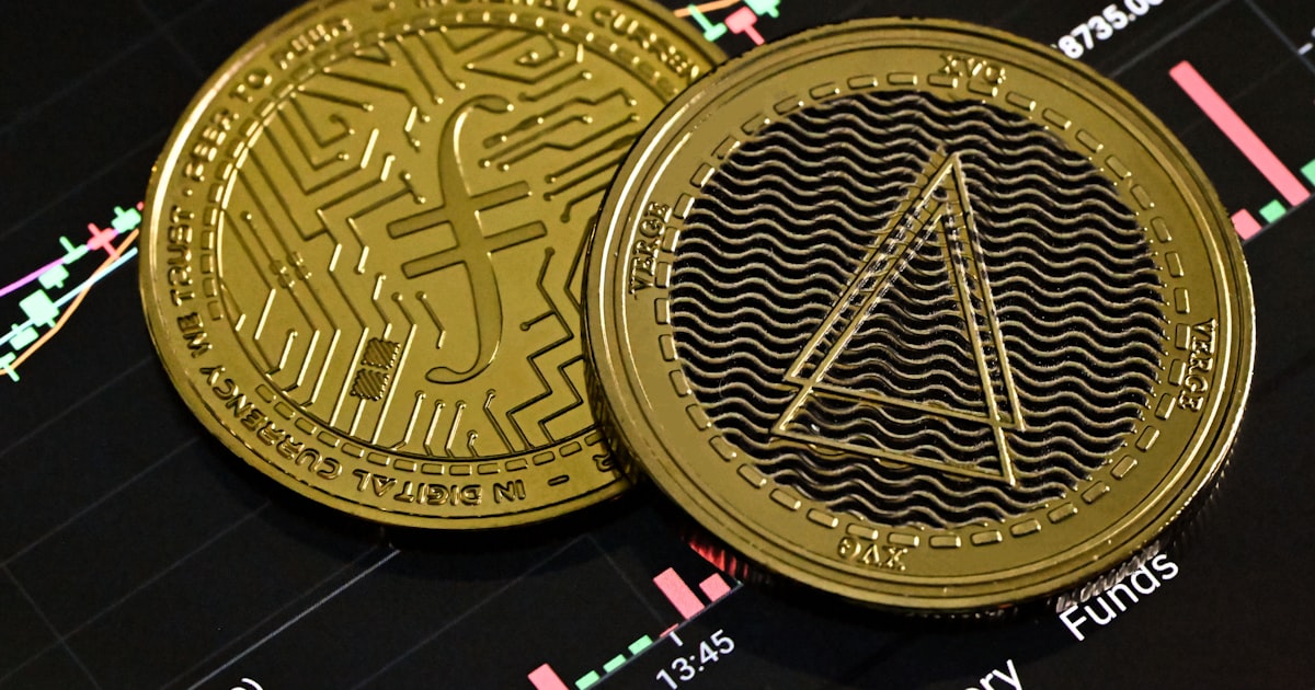 a bitcoin sitting on top of a stock chart