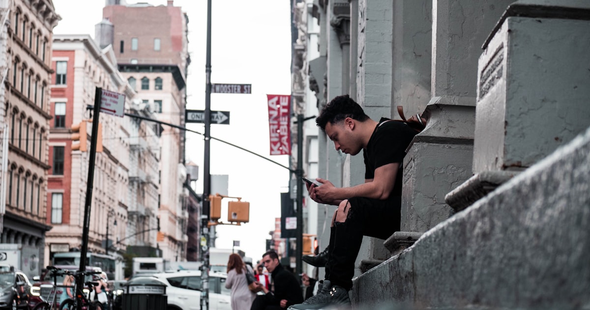 man taking selfie on road