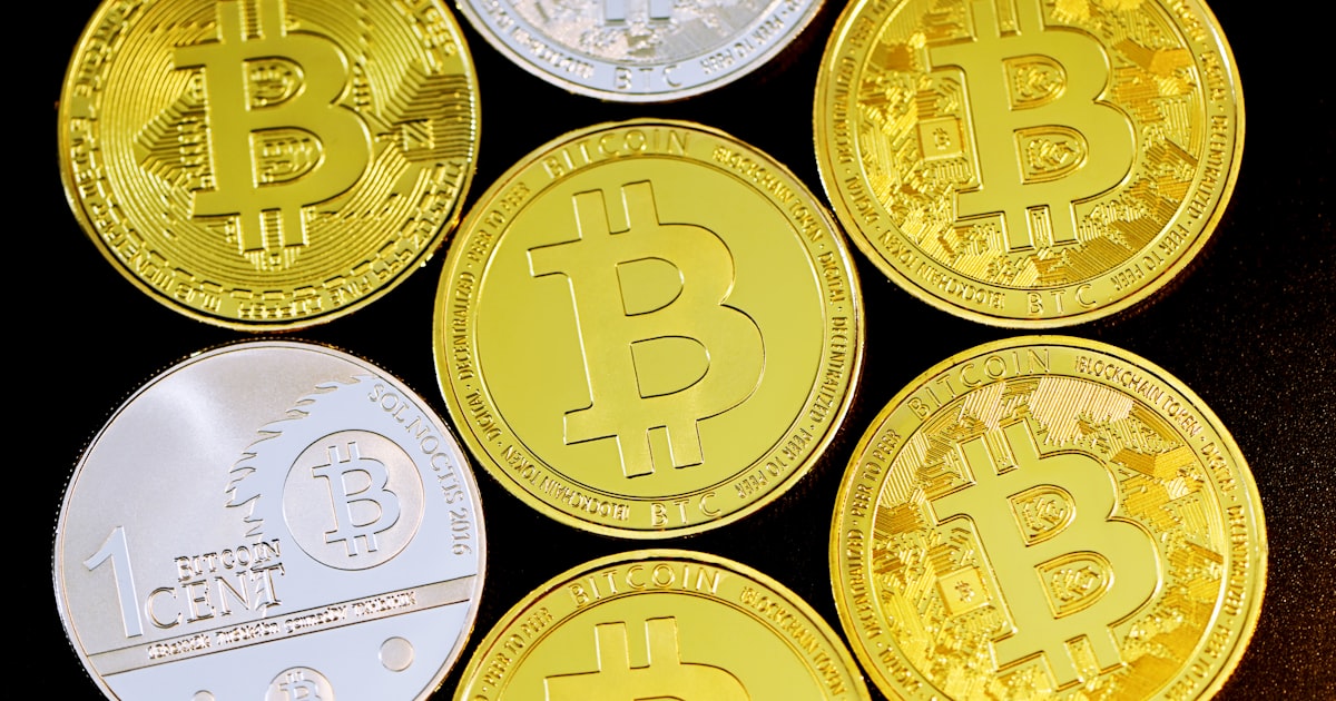 a group of bitcoins sitting on top of each other