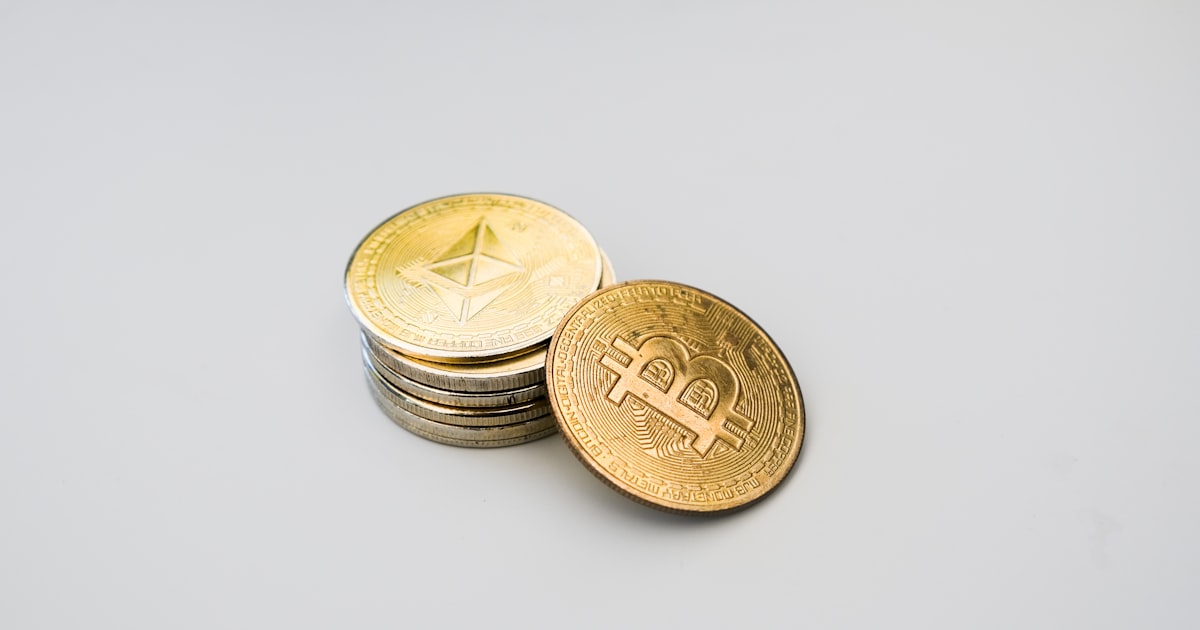 a stack of coins sitting on top of a white table