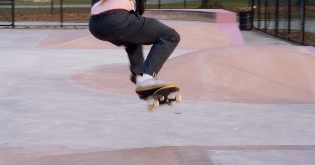 a person jumping a skate board in the air