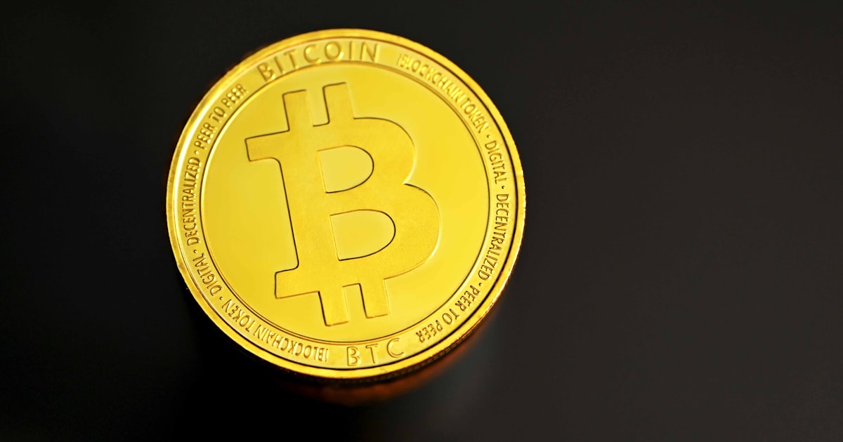 a bit coin sitting on top of a table