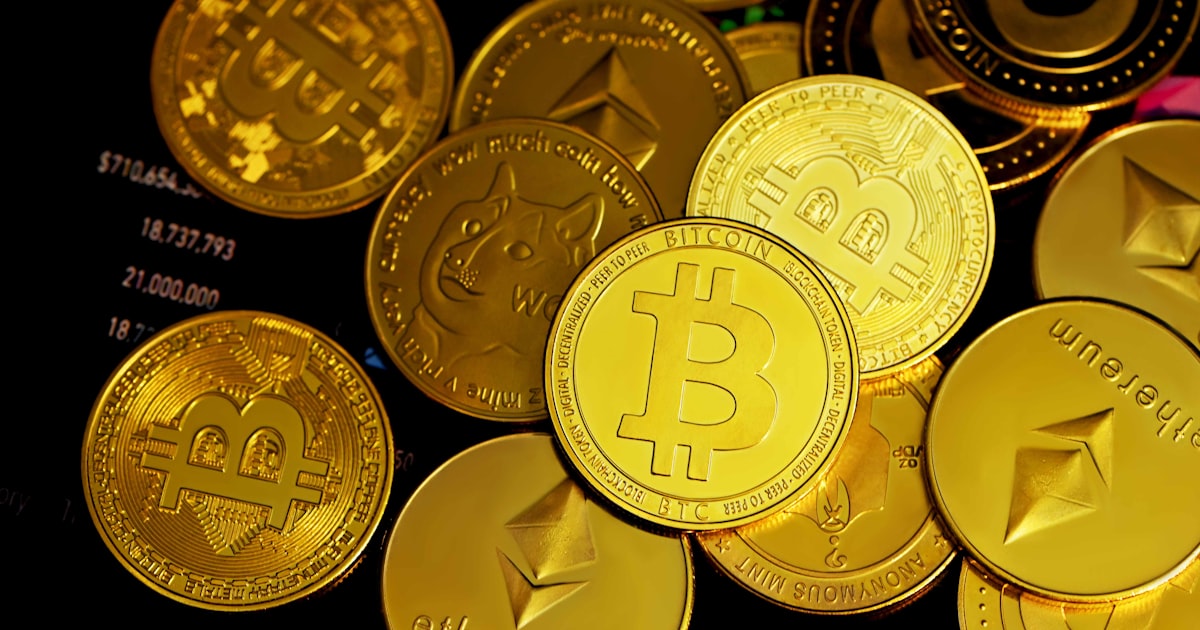 a pile of gold bitcoins sitting on top of each other