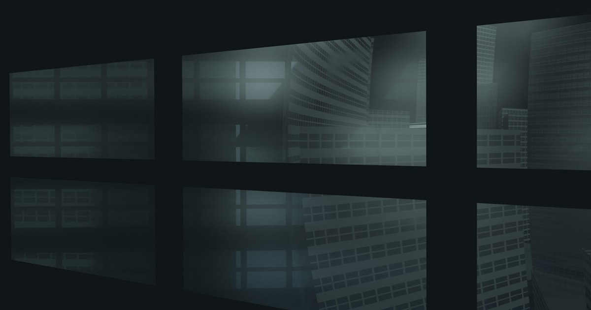 A dark room with multiple windows and a clock on the wall