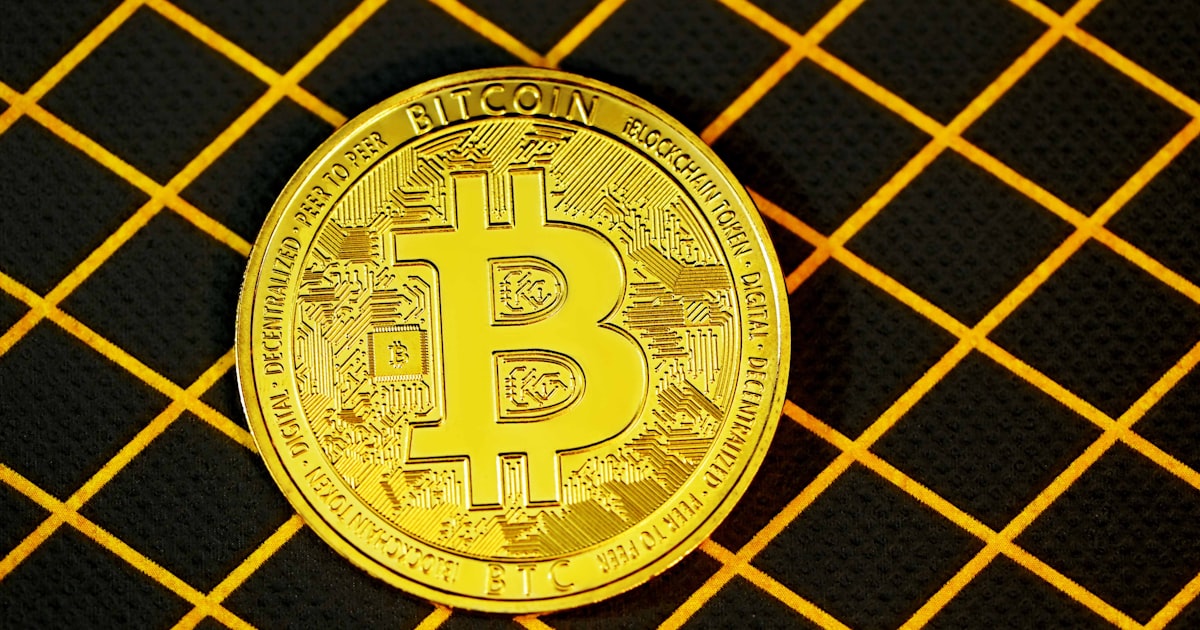 gold and black round logo