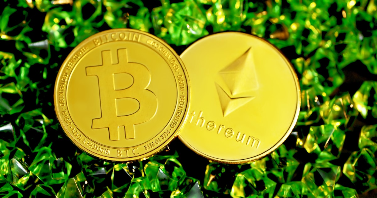 gold round coin on green grass