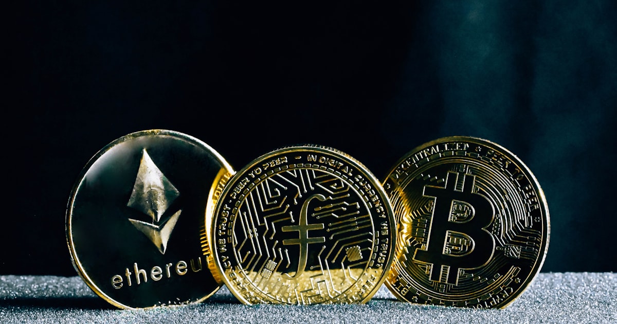 three bitcoins sitting on top of a table