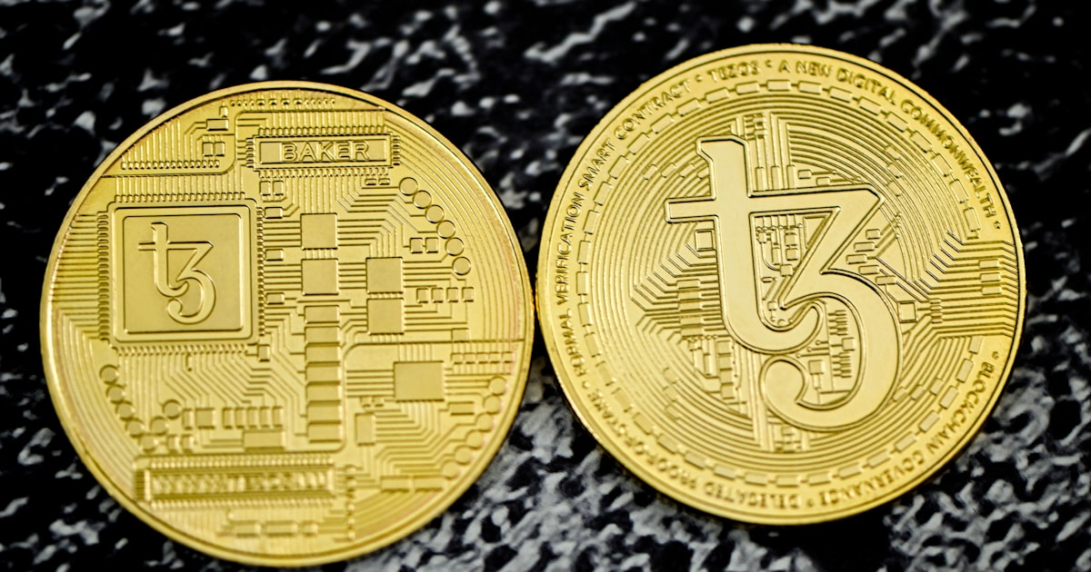 a close up of two gold bitcoins