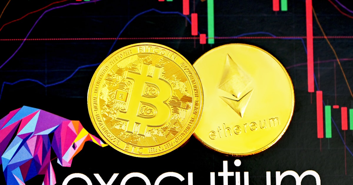 gold round coin on blue textile