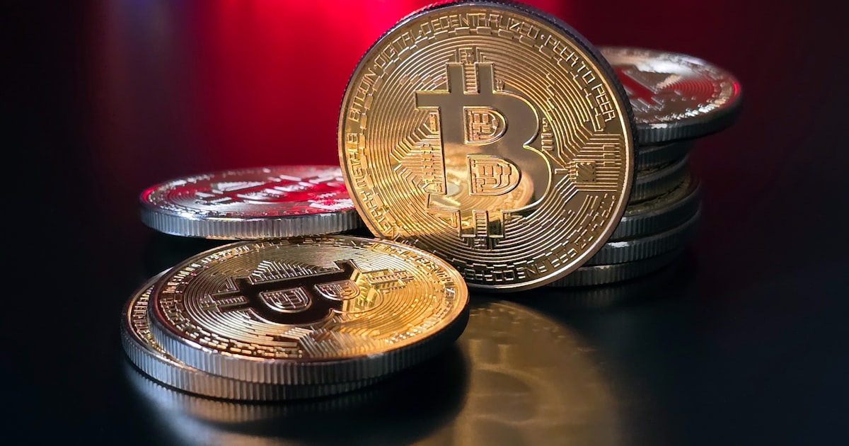 a pile of bitcoins sitting on top of a table