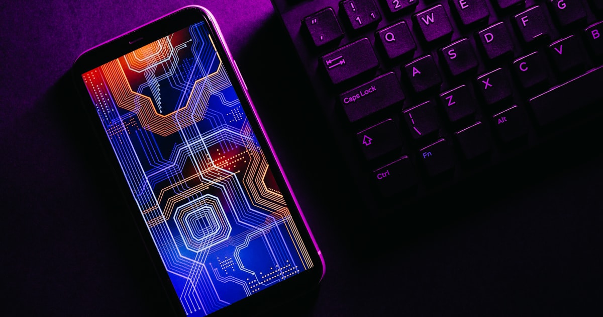 a cell phone on a keyboard