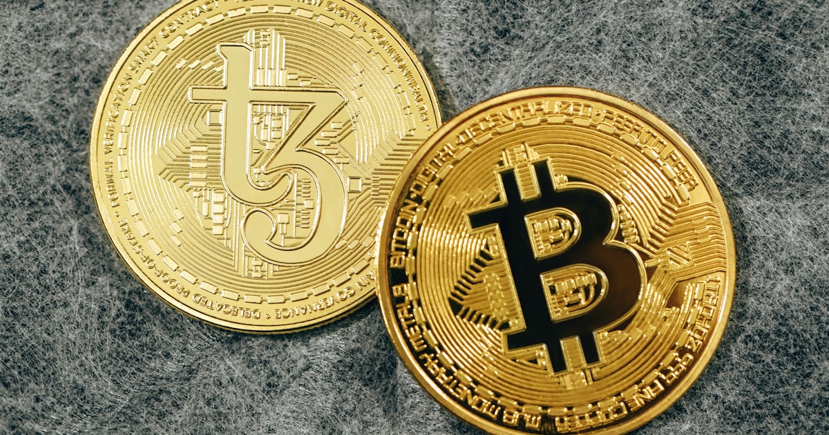 a bit coin sitting on top of a gray surface