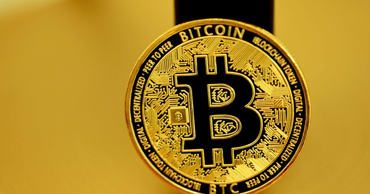 gold and black round logo