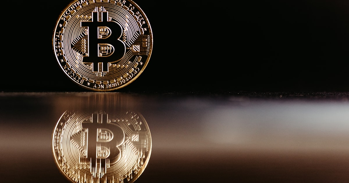 a bit coin sitting on top of a table