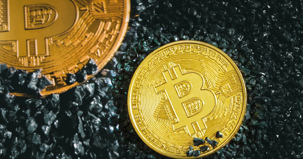 a bitcoin sitting next to a bitcoin on the ground