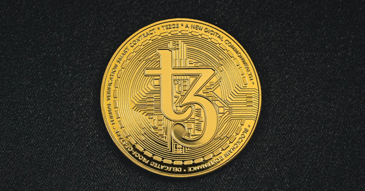 a gold coin with the number five printed on it