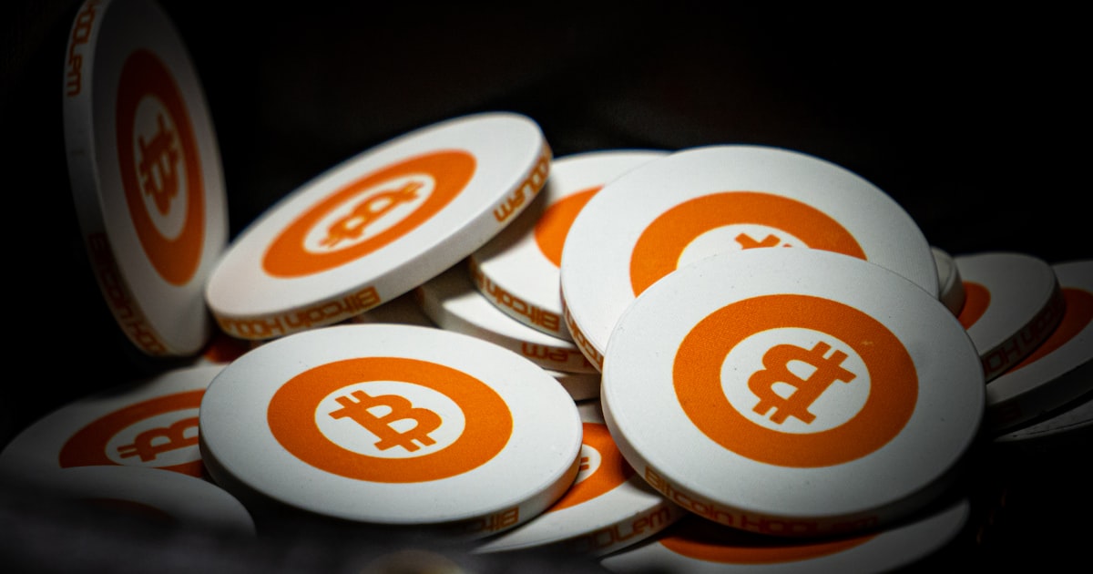 white and orange bitcoin chips
