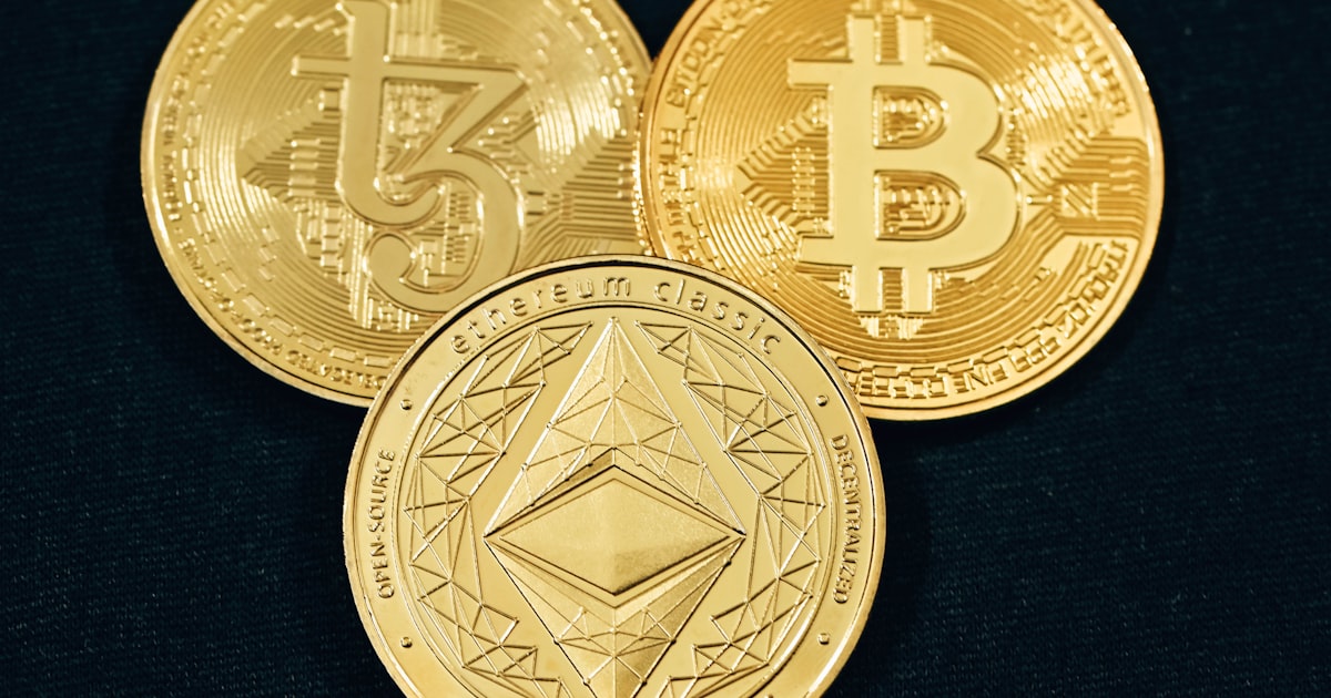 three gold bitcoins on a black background