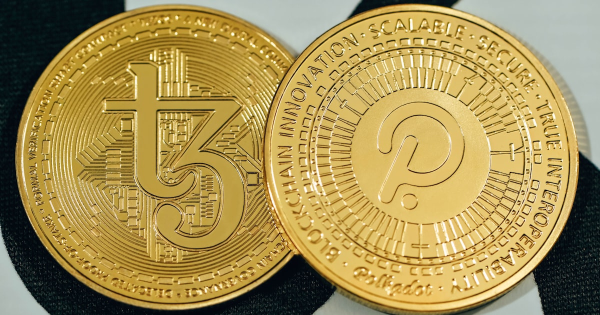 a close up of two gold coins on a black and white background