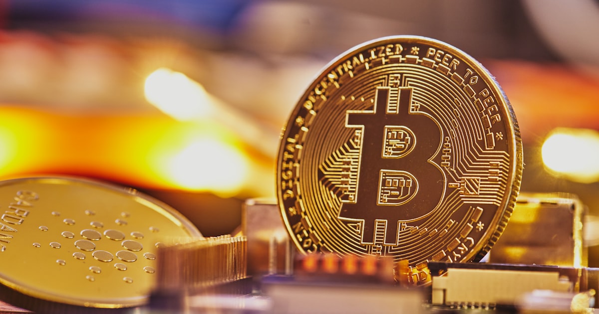 a bit coin sitting on top of a pile of coins