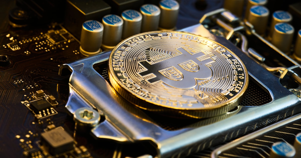 a bit coin sitting on top of a motherboard